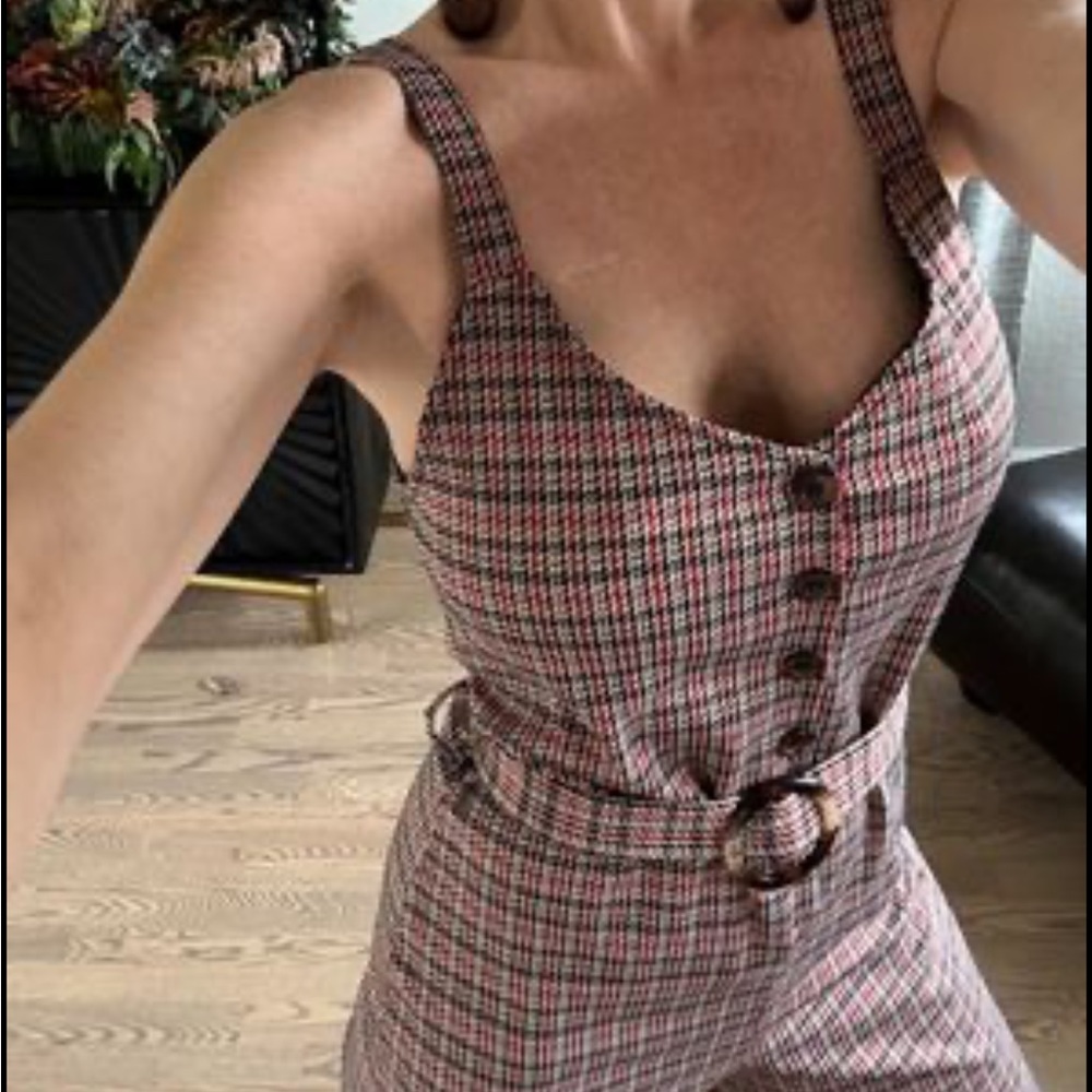 Easy pull on Plaid jumper size medium.